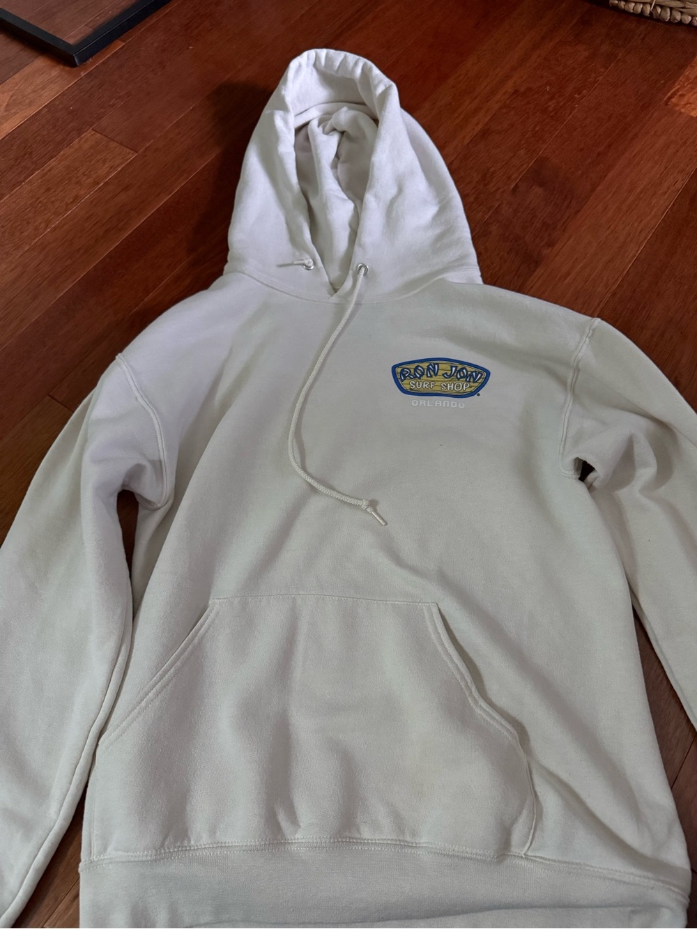 Ron Jon Orlando Cream Pullover Hoodie with Blue & Yellow Logo